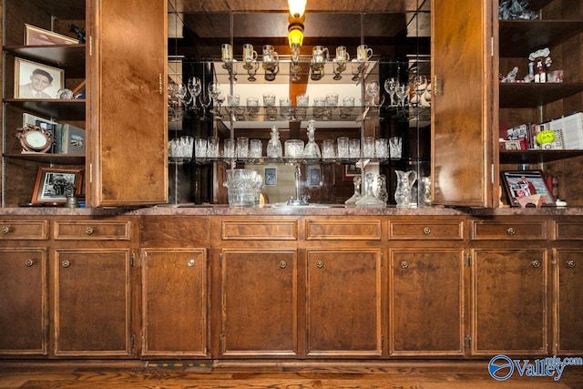 bar featuring hardwood / wood-style flooring