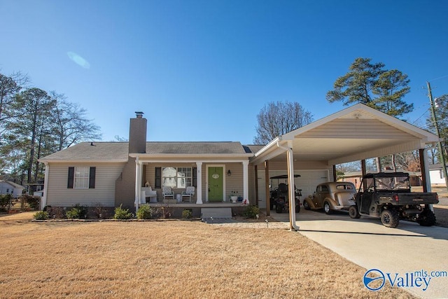 view of front of property with covered porch, a front yard, and a carport