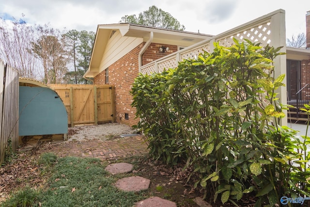 view of property exterior with a patio