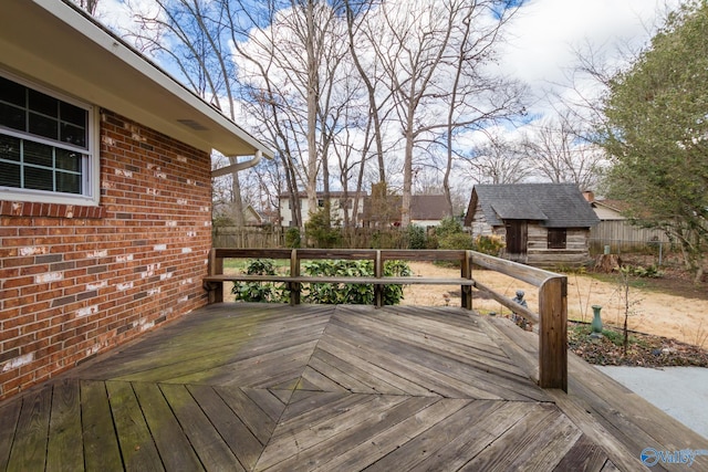 wooden deck featuring a storage shed