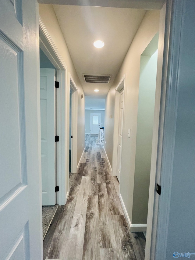 hallway featuring wood-type flooring