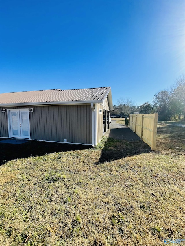 view of property exterior with a yard