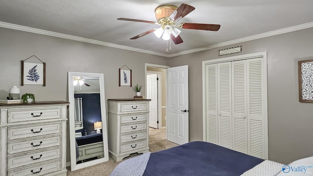 carpeted bedroom with ornamental molding, a closet, and ceiling fan