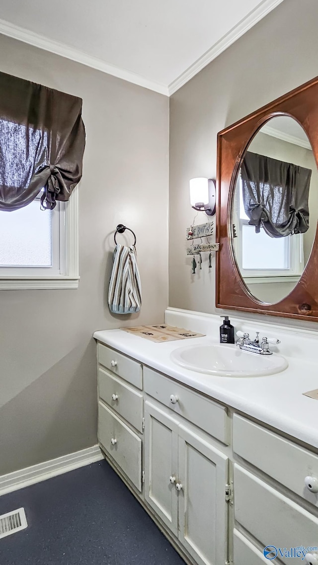 bathroom with vanity and ornamental molding