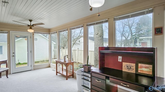 sunroom with wood ceiling and ceiling fan