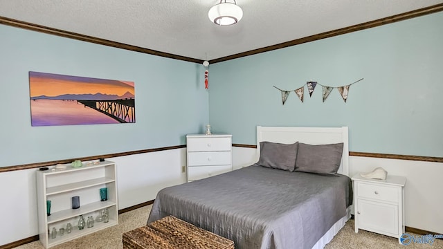 bedroom featuring ornamental molding, light carpet, and a textured ceiling