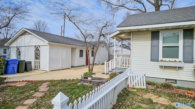 view of side of property with a patio area