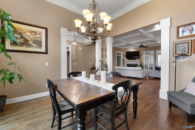 dining area with coffered ceiling, a fireplace, wood finished floors, a ceiling fan, and decorative columns