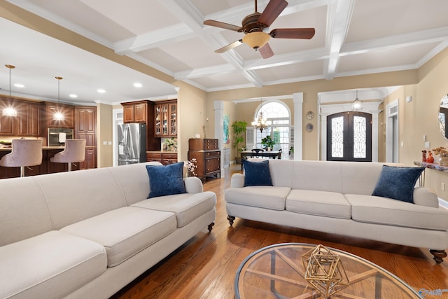 living area featuring french doors, beam ceiling, recessed lighting, wood finished floors, and coffered ceiling