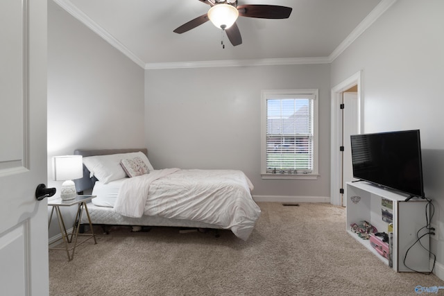 carpeted bedroom featuring ornamental molding, visible vents, ceiling fan, and baseboards