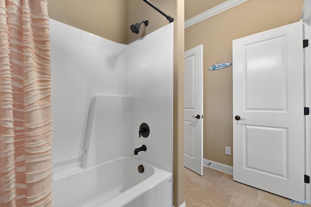 bathroom featuring tile patterned flooring, crown molding, baseboards, and shower / bath combination with curtain