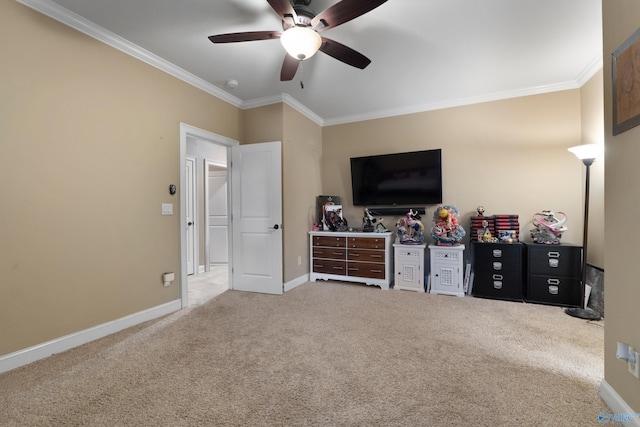 bedroom with carpet, crown molding, baseboards, and ceiling fan