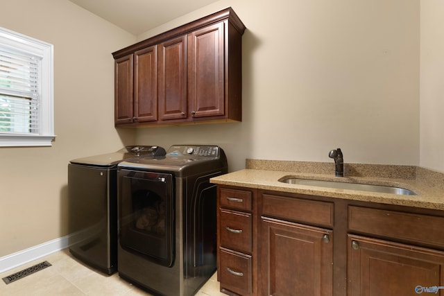 laundry room with separate washer and dryer, a sink, visible vents, baseboards, and cabinet space