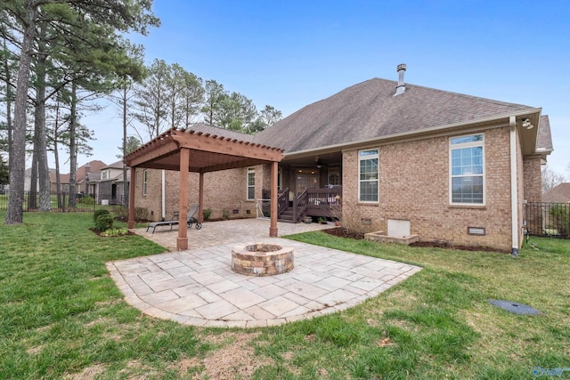 rear view of house featuring brick siding, fence, crawl space, a pergola, and a patio area