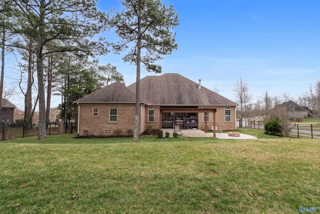 back of house featuring a fire pit, brick siding, crawl space, a lawn, and a patio area