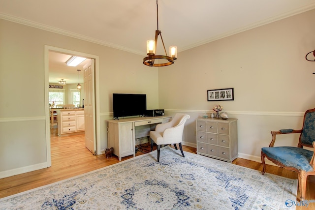 office area featuring baseboards, crown molding, wood finished floors, and a chandelier