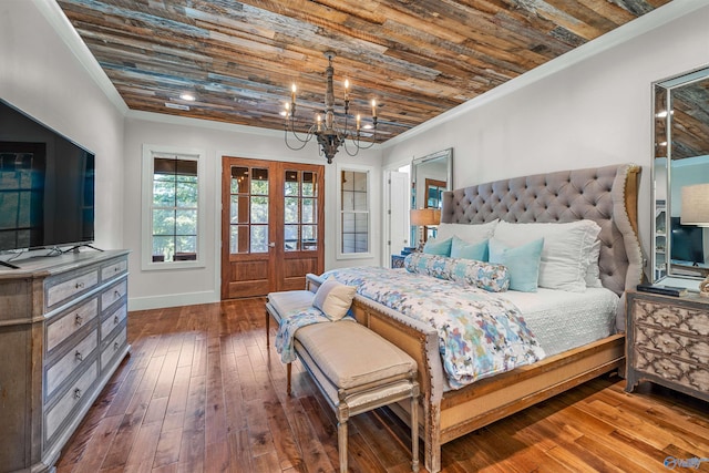 bedroom featuring crown molding, dark wood-type flooring, an inviting chandelier, and wood ceiling