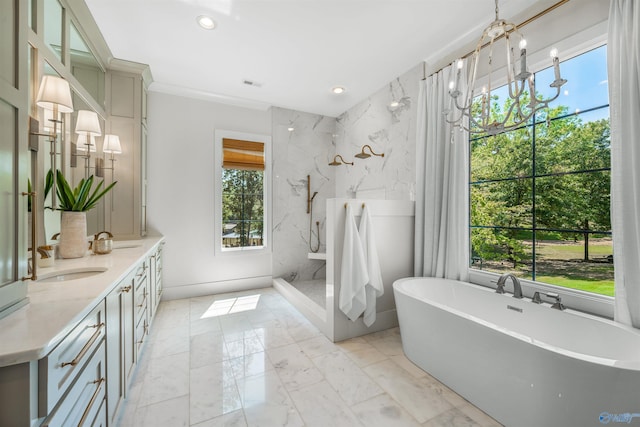 bathroom with vanity, a healthy amount of sunlight, a chandelier, and shower with separate bathtub