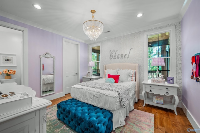 bedroom with light wood-type flooring, a notable chandelier, baseboards, and recessed lighting