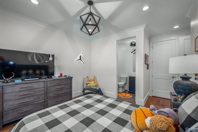 bedroom with ornamental molding, wood finished floors, and recessed lighting