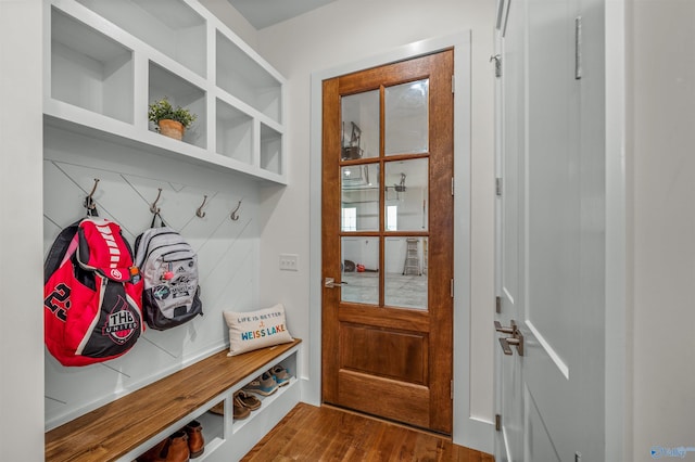 mudroom with dark wood finished floors