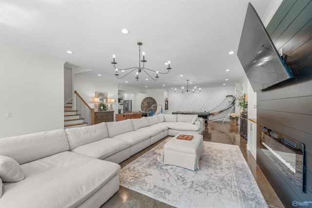 living room featuring stairway, a chandelier, and recessed lighting