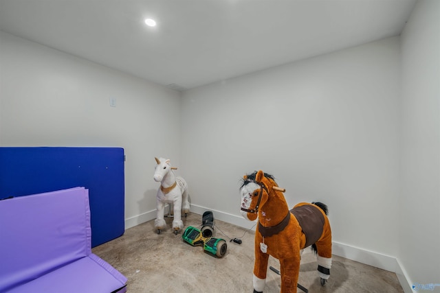 interior space with recessed lighting and baseboards