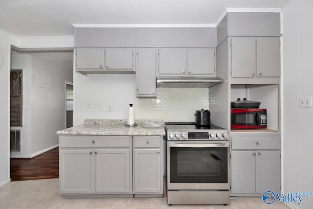 303 Bobwhite Dr SW, Decatur, AL 35601 - kitchen featuring crown molding, stainless steel range with electric stovetop, backsplash, baseboards, and under cabinet range hood