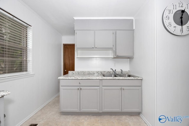 303 Bobwhite Dr SW, Decatur, AL 35601 - kitchen with light countertops, baseboards, ornamental molding, and a sink
