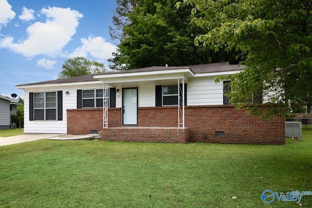 303 Bobwhite Dr SW, Decatur, AL 35601 - ranch-style home with covered porch, a front yard, brick siding, crawl space, and central air condition unit