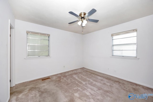 303 Bobwhite Dr SW, Decatur, AL 35601 - unfurnished room with ceiling fan, visible vents, baseboards, and carpet