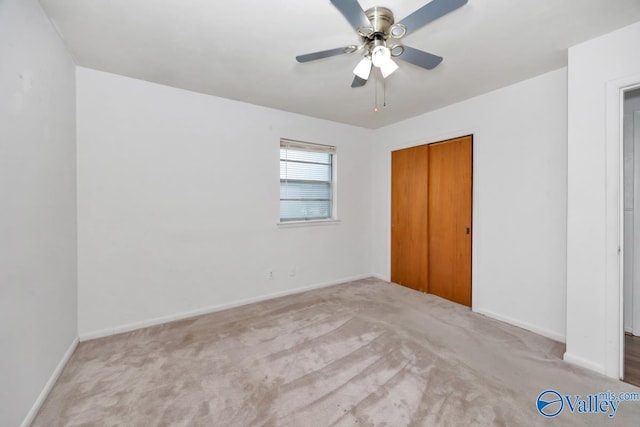 303 Bobwhite Dr SW, Decatur, AL 35601 - unfurnished bedroom with carpet floors, a ceiling fan, baseboards, and a closet