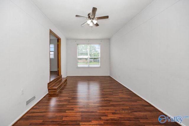 303 Bobwhite Dr SW, Decatur, AL 35601 - unfurnished room featuring baseboards, ceiling fan, visible vents, and wood finished floors