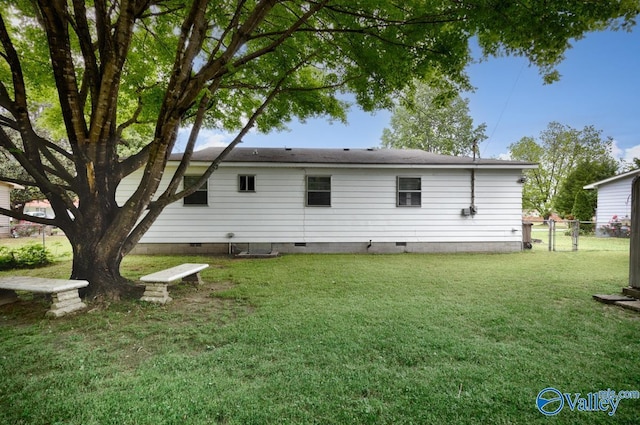 303 Bobwhite Dr SW, Decatur, AL 35601 - back of property with a lawn, crawl space, and fence