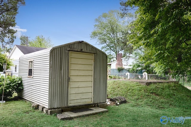 303 Bobwhite Dr SW, Decatur, AL 35601 - view of shed featuring fence