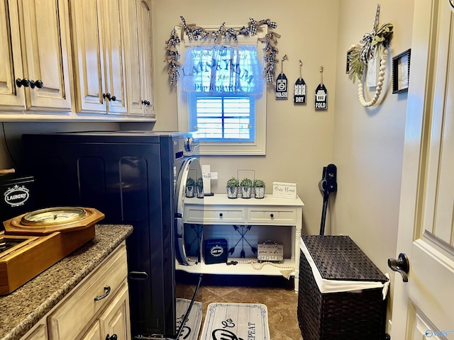 94 Owensby Way, Trinity, AL 35673 - laundry room featuring cabinet space and dark tile patterned flooring