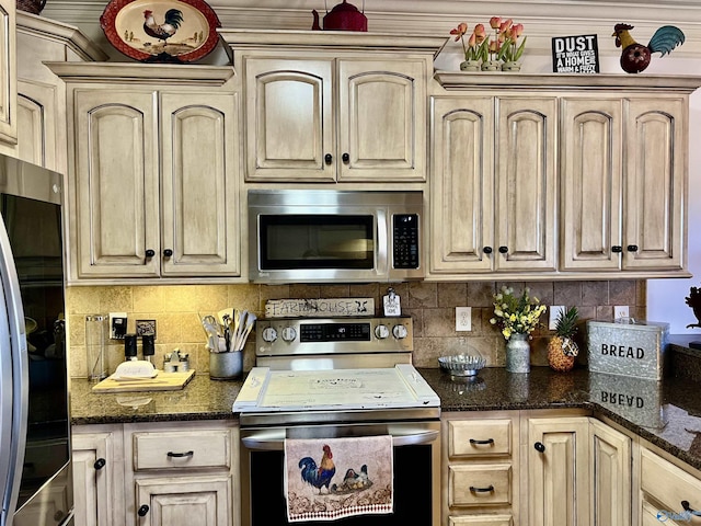 94 Owensby Way, Trinity, AL 35673 - kitchen with stainless steel appliances, backsplash, dark stone countertops, and light brown cabinets