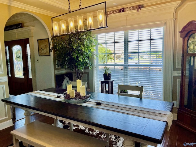 94 Owensby Way, Trinity, AL 35673 - dining area featuring dark wood-type flooring, ornamental molding, and arched walkways