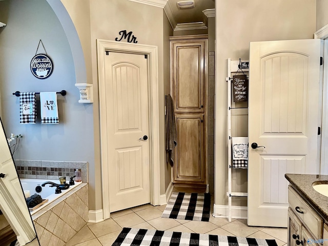 94 Owensby Way, Trinity, AL 35673 - full bath featuring tile patterned flooring, crown molding, a garden tub, vanity, and baseboards