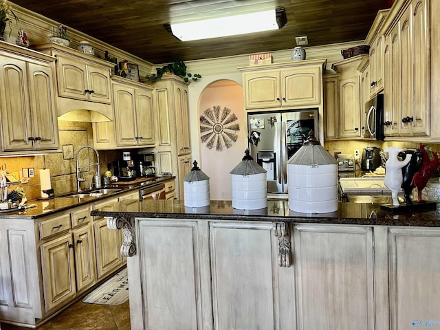 94 Owensby Way, Trinity, AL 35673 - kitchen featuring a sink, stainless steel appliances, backsplash, wood ceiling, and dark stone countertops