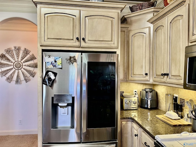 94 Owensby Way, Trinity, AL 35673 - kitchen with stainless steel appliances, arched walkways, backsplash, baseboards, and light brown cabinets