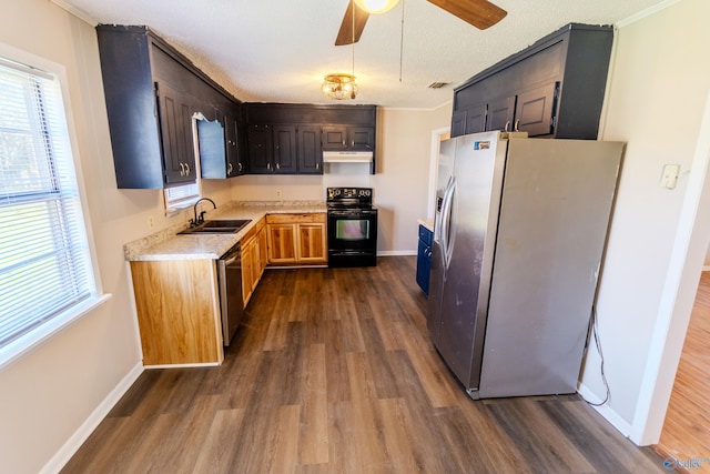 kitchen with dark wood-type flooring, stainless steel appliances, crown molding, and sink