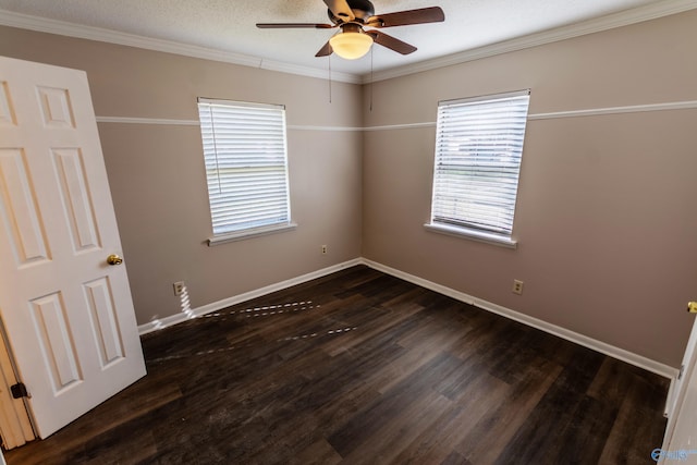 empty room featuring ceiling fan, ornamental molding, dark hardwood / wood-style flooring, and a textured ceiling