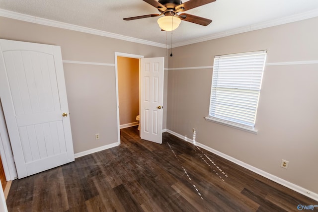 unfurnished bedroom with ornamental molding, dark hardwood / wood-style floors, and ceiling fan