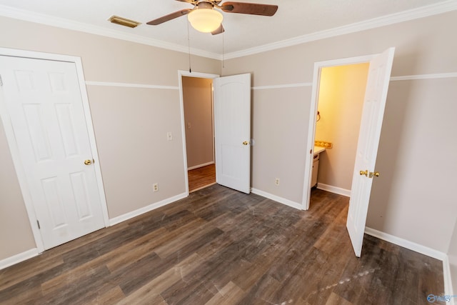 unfurnished bedroom with ornamental molding, dark wood-type flooring, and ceiling fan