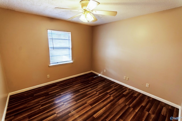 spare room with ceiling fan, dark hardwood / wood-style flooring, and a textured ceiling