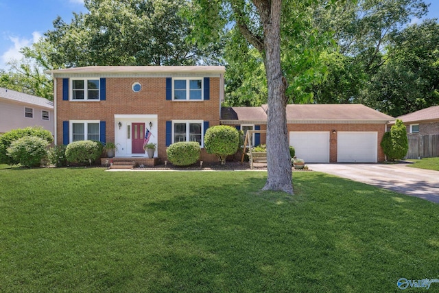 9410 Valley Ln, Huntsville, AL 35803 - colonial inspired home featuring concrete driveway, brick siding, and an attached garage