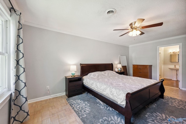 9410 Valley Ln, Huntsville, AL 35803 - bedroom with ornamental molding, a textured ceiling, baseboards, ceiling fan, and a sink