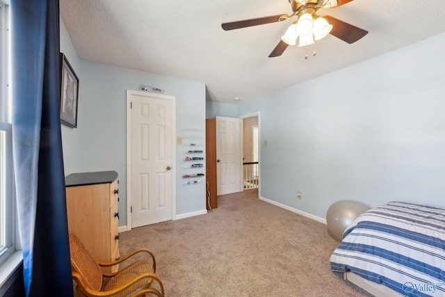 9410 Valley Ln, Huntsville, AL 35803 - carpeted bedroom featuring baseboards and a ceiling fan