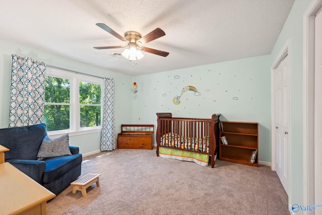 9410 Valley Ln, Huntsville, AL 35803 - carpeted bedroom featuring a textured ceiling, baseboards, and a ceiling fan
